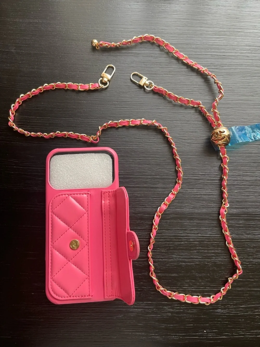 iPhone 17 Pro Max Pink Quilted Phone Case with Gold Chain Strap.